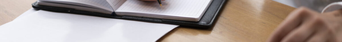 corporate-woman-calculating-writing
